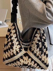 Chic handmade crochet straw tote bag with black and beige knit pattern and ruffled strap