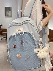 Pastel blue Japanese style school backpack with transparent pocket and cute rabbit charm