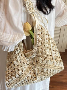 Bohemian woven straw tote bag in beige and light coffee colors for beach vacations