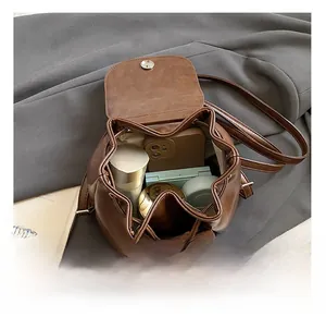 Top view of brown leather drawstring backpack showing interior capacity for daily essentials