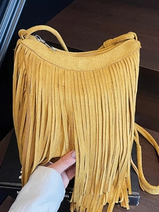 Ginger yellow suede tassel crossbody bag with bohemian fringe detail and metal zipper