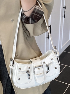 White faux leather Y2K shoulder bag with silver rivets, buckles and chain details