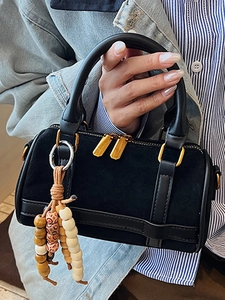 Mini black suede Boston handbag with vintage leopard accents and boho beaded tassel