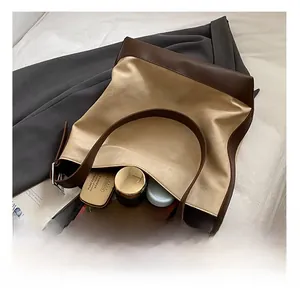 Macro view of large tote bag interior showing spacious capacity for cosmetics and phone