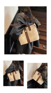 Détail du grand sac cabas en tissu texturé beige avec boucle métallique dorée élégante