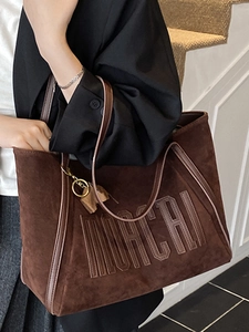 Large dark brown suede tote bag with MACHAI embossed lettering and leather handles