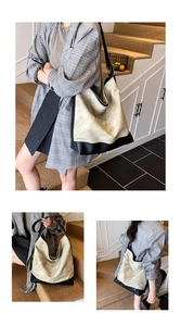 Detail of minimalist cream and black contrast large-capacity tote bag with leather texture