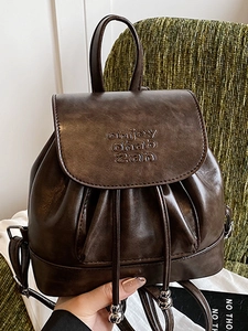 Vintage dark brown faux leather backpack with drawstring closure and top handle strap