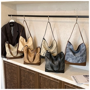 Collection of retro canvas tote bags in five colors with premium brown leather stitching