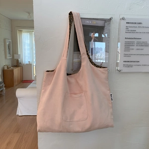 Detailed close-up of pink canvas tote bag showing the stylish leopard print inner lining