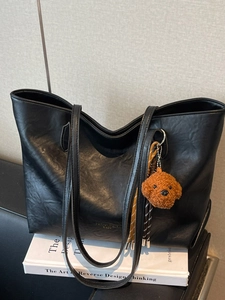 Large black tote bag in premium faux leather with a cute brown dog plush pendant