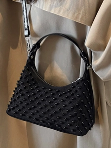 Minimalist black crescent shoulder bag with dense bead studs for a modern chic look