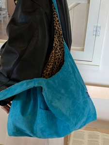 Blue suede hobo shoulder bag with leopard print lining and large capacity minimalist design