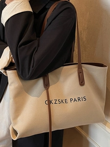 Grand sac cabas en toile beige avec lanières en cuir marron et lettrage PARIS noir