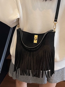 Bohemian black fringe crossbody bag with suede texture and golden metal twist lock closure