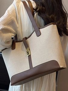 Large capacity canvas and brown leather tote bag with gold twist lock for daily commute