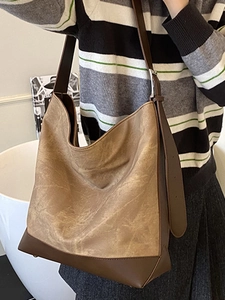 Large retro hobo shoulder bag in khaki PU leather with brown contrast trim and strap