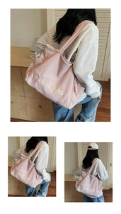 Detailed close-up of pink corduroy tote bag showing ribbed texture and TOTE BAG embroidery