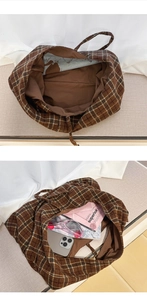 Detail of spacious brown plaid tote bag interior with corduroy texture and inner lining