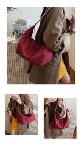 Detail view of burgundy suede hobo bag with stylish knotted shoulder strap and silver zip