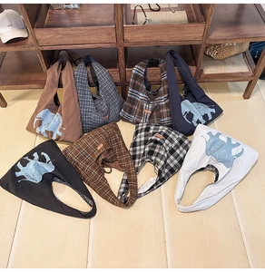 Various Japanese canvas tote bags in solid colors with elephant prints and plaid patterns