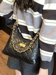 Chic black quilted half-moon shoulder bag with gold chain strap and turn-lock closure