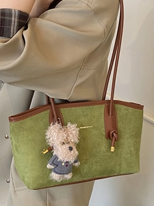 Retro grass green suede tote bag with brown leather straps and plush puppy charm