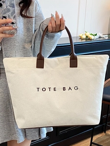 Vintage corduroy tote bag in off-white with leather handles for daily commute