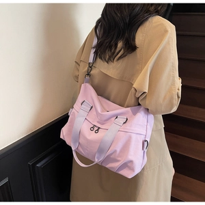 Detail of light purple large capacity nylon tote bag with wide straps for casual travel