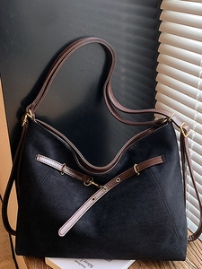 Retro black matte tote bag with brown leather straps and vintage metal hardware