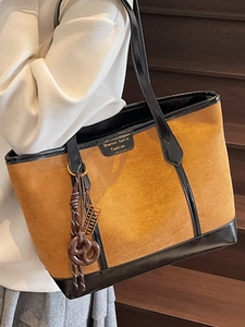 Retro large brown suede tote bag with black leather trim and pretzel charm accessory