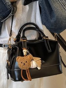 Premium black oil wax leather pillow bag with charms and adjustable shoulder strap