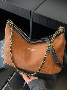 Retro brown suede shoulder bag with black leather trim and golden chain strap