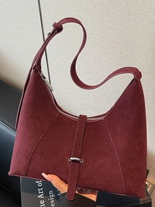 Chic burgundy suede crescent shoulder bag with lychee texture and metal buckle detail