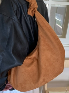 Brown velvet slouchy shoulder bag with knotted strap and silver zipper closure