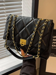 Classic black quilted chain shoulder bag with gold metal lock and lychee leather texture
