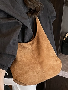 Caramel brown matte suede hobo bag large shoulder tote shown on model for 2025 summer style