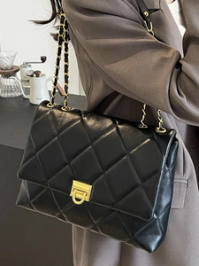 Classic black quilted chain bag for women with gold rotating lock and elegant leather finish
