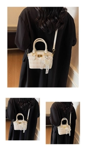 Detail of checkered mini crossbody bag featuring a golden twist lock and pearl heart charm