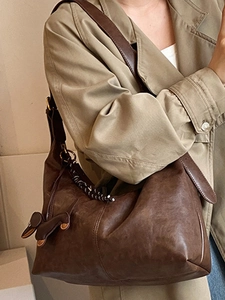 Large dark brown leather hobo bag with vintage texture and cute dachshund charm