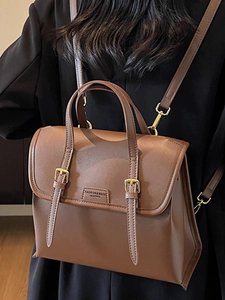 Vintage brown leather convertible backpack and tote bag with gold buckle straps for women