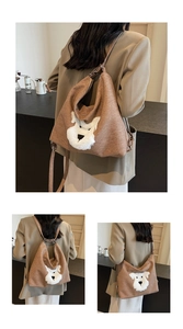 Detailed side view of brown large capacity Hobo bag with cute dog embroidery patch