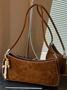 Vintage brown suede baguette bag with decorative wooden beads for summer commute fashion