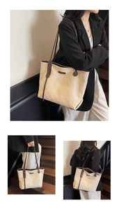 Detail of off-white quilted tote bag with brown leather straps and diamond lattice pattern