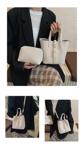 Detail view of cream bucket bag and matching coin purse in premium pebbled leather