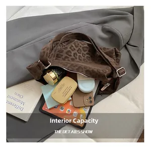 Macro shot of leopard print tote bag interior showing large capacity for daily essentials