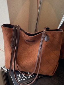 Chic quilted tan suede tote bag with diamond stitching for minimalist commute style