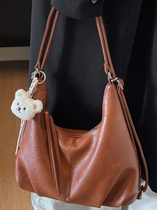 Brown faux leather tote bag with plush bear charm, minimalist casual shoulder bag for women