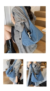 Detail of dark blue leopard print hobo bag with colorful beaded tassel in casual indoor setting
