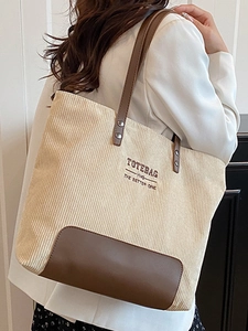 Grande borsa tote in velluto a coste beige con base e manici in pelle marrone moda